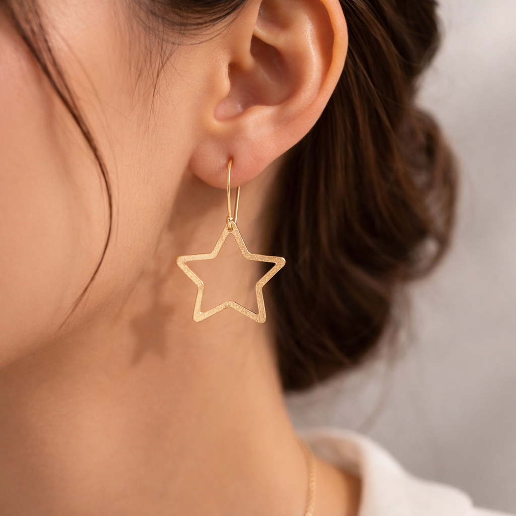 Gold Tone Star Outline Dangle Earrings