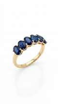 Blue Sapphire Eternity Band in Gold Finish